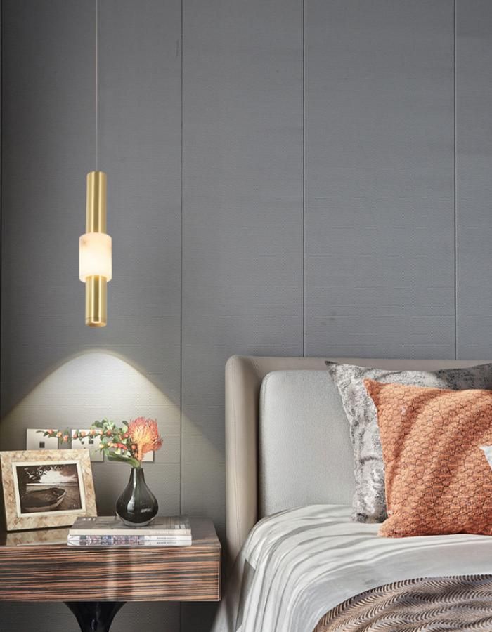 Luxury modern brass alabaster LED pendant light, warm glow bedside hanging lamp for bedroom interior ambient lighting