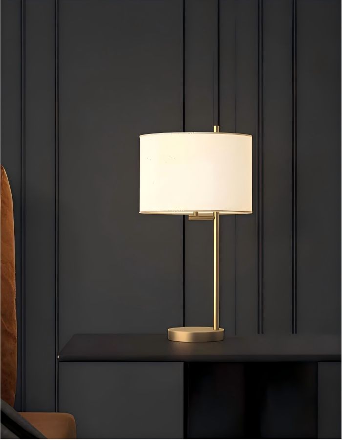 Minimalist brass table lamp on bedroom desk, modern desk lamp with drum fabric shade for workspace